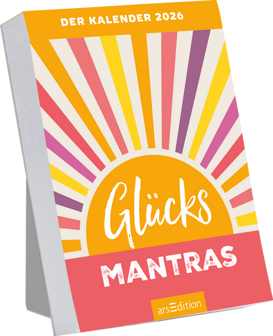 Das Buchcover zeigt einen strahlenden Sonnenaufgang mit bunten Strahlen in Gelb, Pink, Lila und Orange. Im unteren Bereich prangt der Titel „Glücks Mantras“ in einer verspielten, handschriftlichen Schriftart, die freundlich und einladend wirkt. Oben steht der Text „DER KALENDER 2026“ in klarer, moderner Typografie. Die Atmosphäre des Covers ist optimistisch und kreativ. Ganz unten mittig steht der Logoschriftzug von arsEdition.