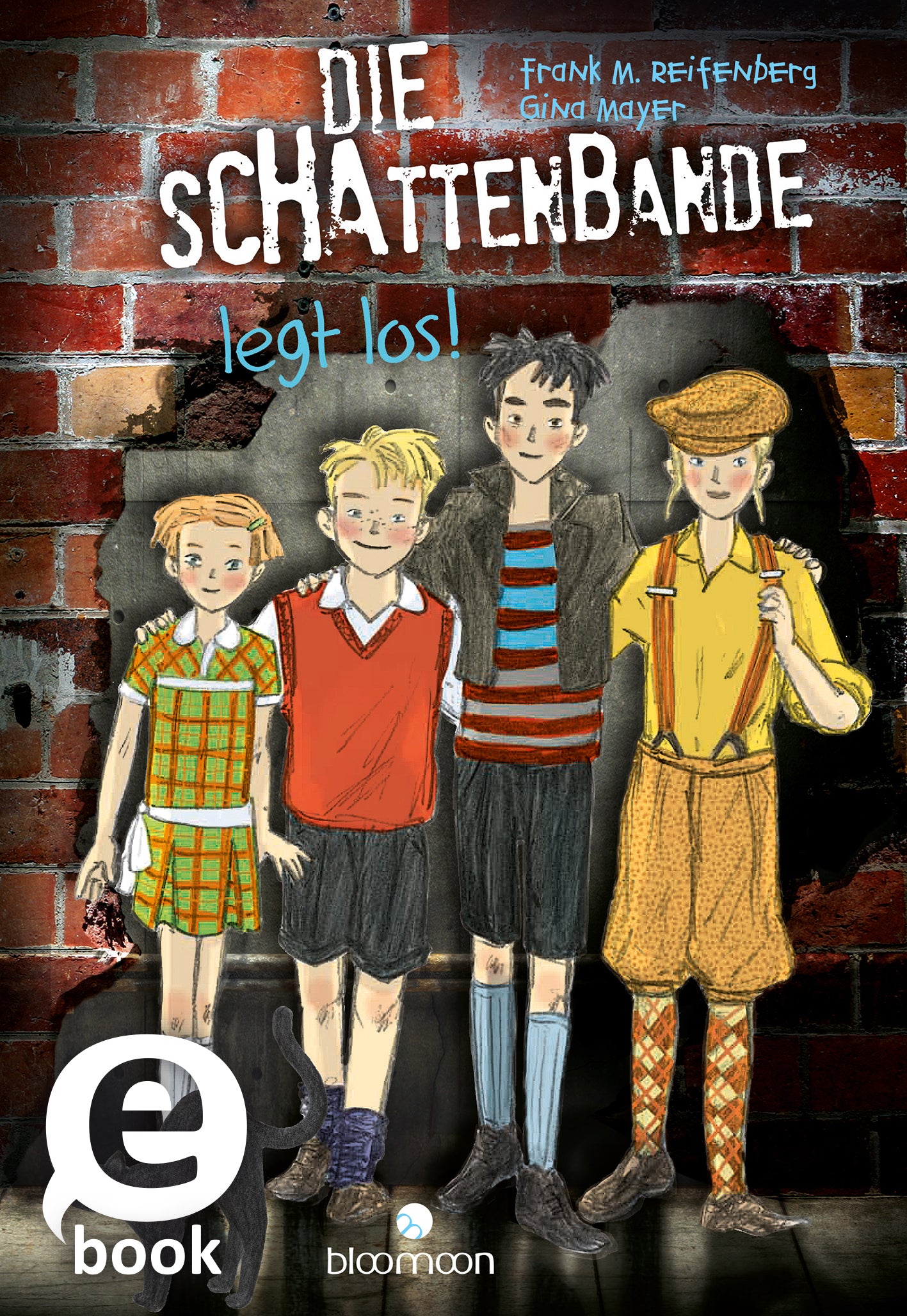 Das Buchcover zeigt vier Kinderfiguren, die vor einer Backsteinmauer stehen. Die Figuren sind in bunten, kindgerechten Outfits gekleidet; eine hat ein kariertes Hemd, eine andere ein rotes Shirt mit V-Ausschnitt. Die Titelgrafik „DIE SCHATTENBANDE“ ist in großen, weißen Buchstaben am oberen Rand platziert, während der Zusatz „legt los!“ darunter in kleinerer, gelber Schrift steht. In der oberen linken Ecke befindet sich ein „eBook“-Icon. Ganz unten mittig steht der Logoschriftzug...