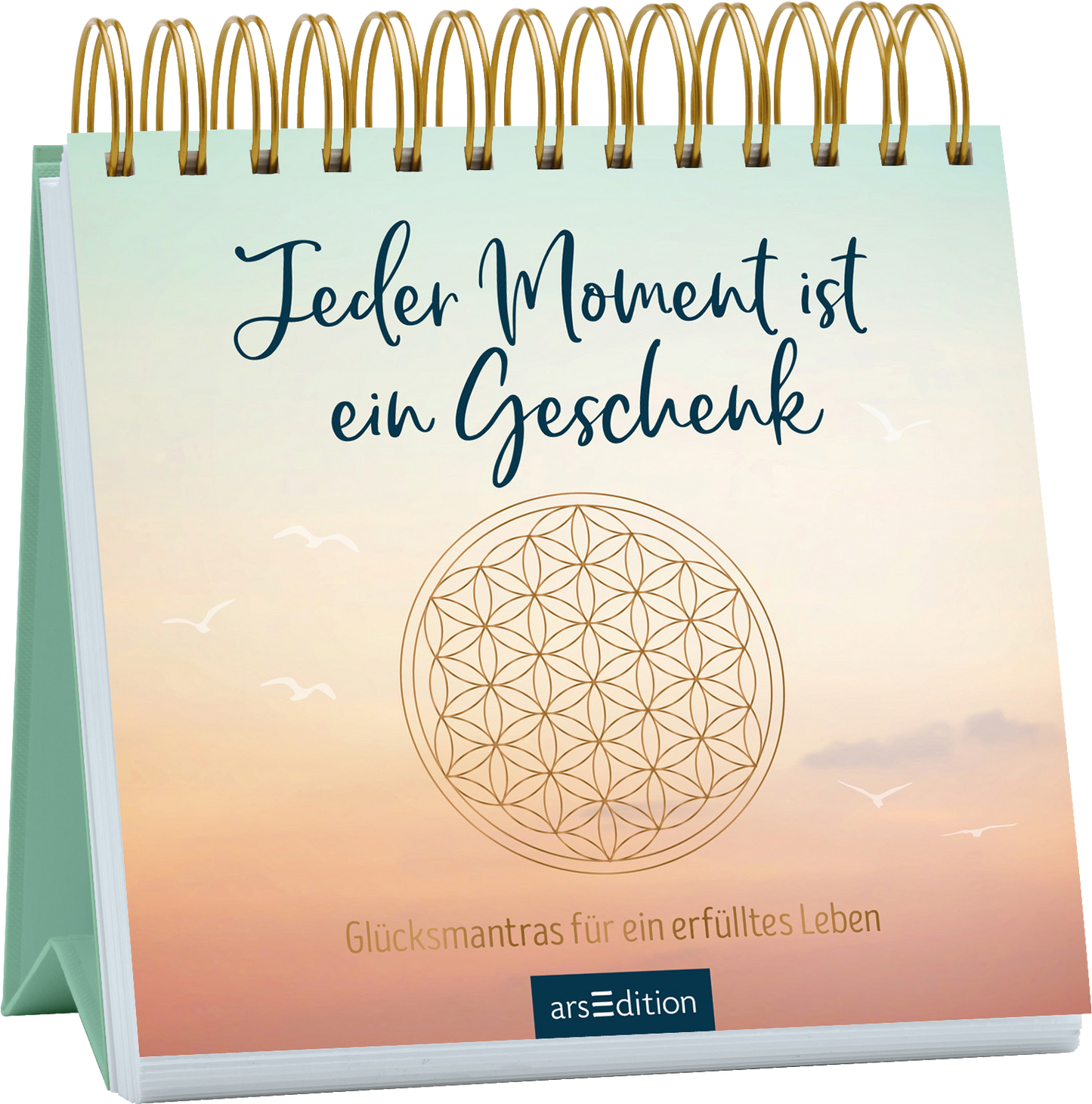 Das Buchcover zeigt eine sanfte Farbverlauf, der von einem hellen Türkis über ein zartes Rosa bis zu einem sanften Beige übergeht. In der Mitte steht in geschwungener blauer Schrift der Titel „Jeder Moment ist ein Geschenk“. Darunter befindet sich der Untertitel „Glücksmantras für ein erfülltes Leben“ in einer klaren, serifenlosen Schrift. Ein stilisiertes, kreisförmiges Motiv, das die „Blume des Lebens“ darstellt, ergänzt das Design. Ganz unten mittig steht der...