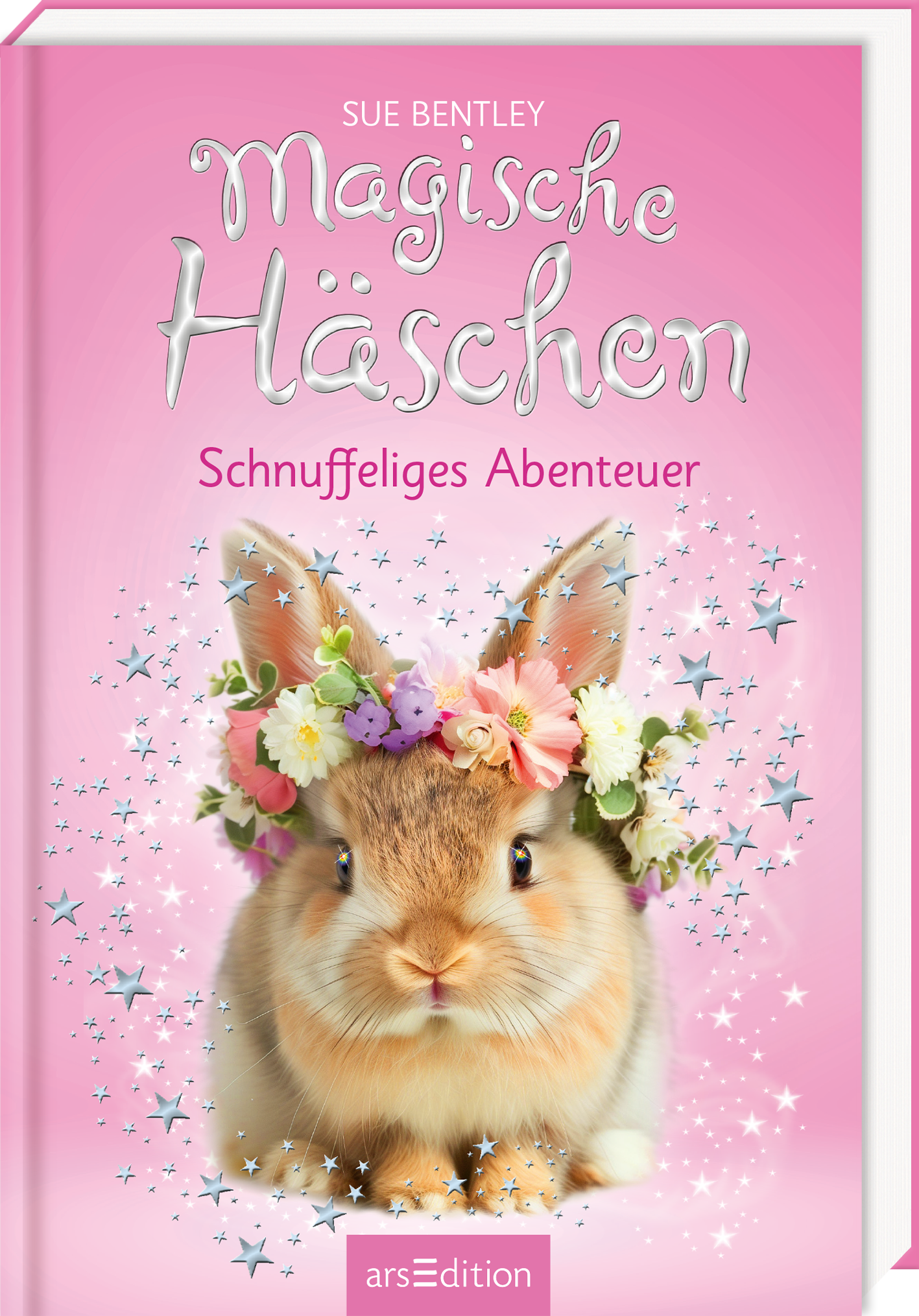 Auf dem Buchcover von „Magische Häschchen – Schnuffeliges Abenteuer“ von Sue Bentley ist ein süßes, flauschiges Kaninchen zu sehen, das mit einem bunten Blumenkranz geschmückt ist. Der Hintergrund ist in einem sanften Rosaton gehalten, durchzogen von glitzernden Sternen, die eine zauberhafte Atmosphäre schaffen. Der Titel ist in verspielter, geschwungener Schrift gestaltet und hebt sich in Weiß ab. Darunter steht die Unterzeile in harmonievollem Schriftbild. Ganz unten mittig steht...