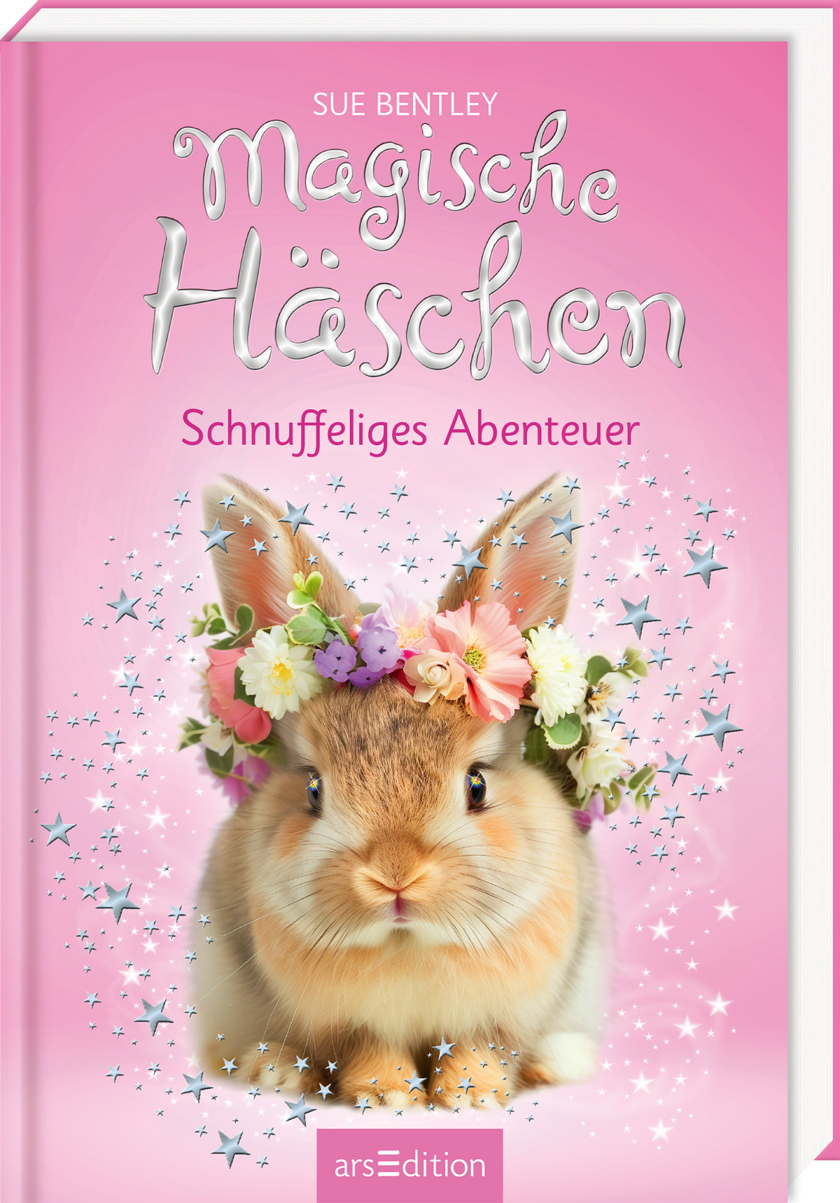 Auf dem Buchcover von „Magische Häschchen – Schnuffeliges Abenteuer“ von Sue Bentley ist ein süßes, flauschiges Kaninchen zu sehen, das mit einem bunten Blumenkranz geschmückt ist. Der Hintergrund ist in einem sanften Rosaton gehalten, durchzogen von glitzernden Sternen, die eine zauberhafte Atmosphäre schaffen. Der Titel ist in verspielter, geschwungener Schrift gestaltet und hebt sich in Weiß ab. Darunter steht die Unterzeile in harmonievollem Schriftbild. Ganz unten mittig steht...