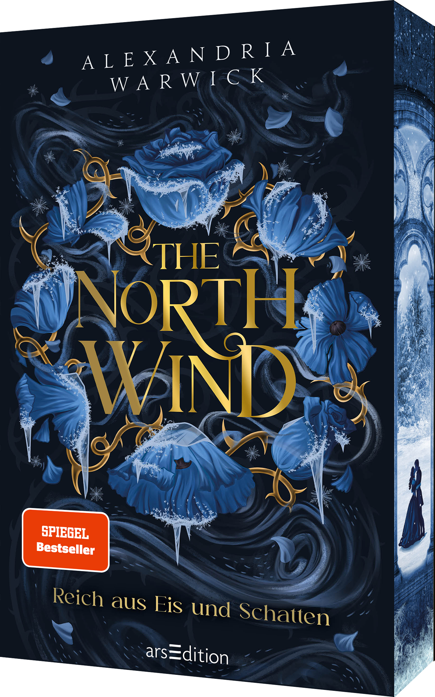 Das Buchcover zeigt eine mystische, dunkle Szenerie mit einer überwiegend blauen Farbpalette. In der Mitte steht der Titel „THE NORTH WIND“ in eleganter, goldener Schrift, umgeben von stilisierten blauen Blumen und Schneeflocken, die eine geheimnisvolle Atmosphäre schaffen. Im unteren linken Bereich befindet sich ein roter Button mit dem Text „SPIEGEL Bestseller“. Ganz unten mittig steht der Logoschriftzug von arsEdition.