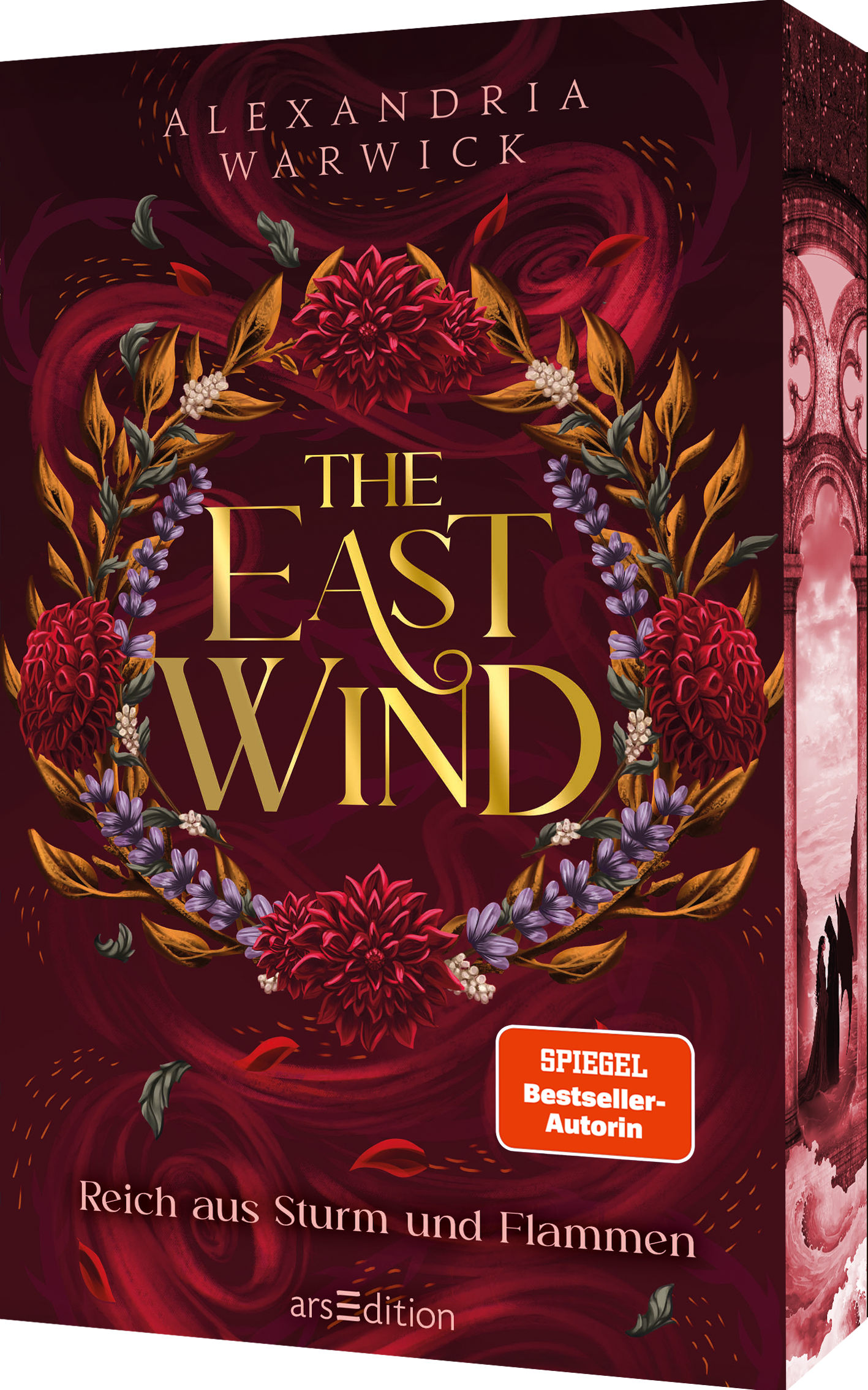 Das Buchcover zeigt einen opulenten, blühenden Kranz in satten Rottönen und goldenen Akzenten. Der Titel „THE EAST WIND“ ist in eleganter, geschwungener Schriftart in goldener Farbe gehalten. Unter dem Titel befindet sich der Zusatz „Reich aus Sturm und Flammen“. Ein roter SPIEGEL-Bestseller-Button ist in der unteren rechten Ecke platziert und weist auf die Autorin als Bestseller-Autorin hin. Ganz unten mittig steht der Logoschriftzug von arsEdition.