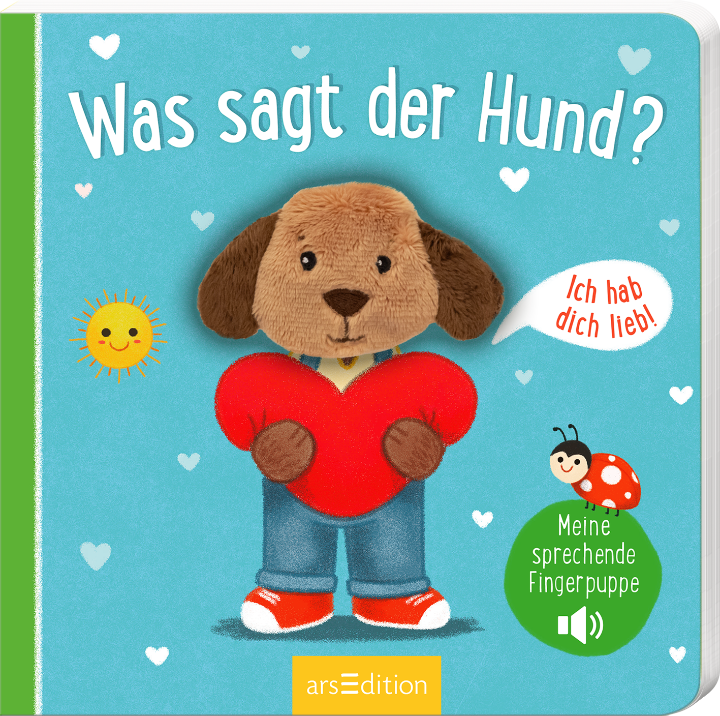 Das Cover zeigt einen niedlichen, plüschigen Hund mit einem herzförmigen roten Kissen. Der Hund trägt ein blaues Shirt und eine blaue Jeans. Der Hintergrund ist in einem sanften Himmelblau gehalten, dekoriert mit kleinen weißen Herzen und einer gelben Sonne. Die Titelzeile „Was sagt der Hund?“ ist in verspielter Schrift in Weiß gestaltet. Im oberen Bereich spricht eine Sprechblase mit dem Text „Ich hab dich lieb!“. Rechts ist ein grüner Button mit der Aufschrift „Meine...