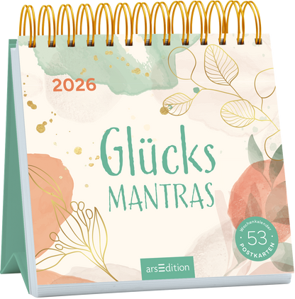 Das Buchcover zeigt einen spiralförmigen Wochenkalender in sanften Pastelltönen, dominiert von mintgrünen und rosafarbenen Wasserfarben. Der Titel „Glücks Mantras“ ist in einer verspielten, großen Schrift in mintgrün gestaltet. Im oberen Bereich befindet sich die Jahreszahl „2026“ in kräftigem orange. Goldene Akzente und zarte Pflanzenillustrationen verleihen dem Cover eine harmonische Atmosphäre. In der unteren rechten Ecke ist ein Button mit dem Text „53 Postkarten“ zu...