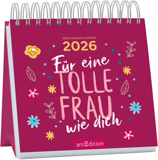 Auf einem kräftig pinken Hintergrund steht in großen, geschwungenen, weißen Buchstaben „Für eine TOLLE FRAU wie dich“. Oben rechts ist in goldener Schrift das Jahr „2026“ zu sehen. Um den Schriftzug herum befinden sich bunte, handgezeichnete Blumen und Blätter, die eine fröhliche Atmosphäre erzeugen. Ganz unten mittig steht der Logoschriftzug von arsEdition.