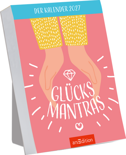 Das Buchcover zeigt einen sanften rosa Hintergrund mit zwei Händen, die einen Diamanten formen. Die Hände sind in leuchtendem Gelb gehalten und bilden einen warmen Kontrast. In der Mitte steht der Titel „GLÜCKSMANTRAS“ in großer, weißer Schrift, umgeben von stilisierten, fröhlichen Linien und einem Herz. Oben links findet sich der Schriftzug „DER KALENDER 2027“. Ganz unten mittig steht der Logoschriftzug von arsEdition.