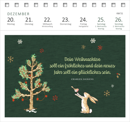 Gezeigt wird eine Innen- oder Zusatzansicht von „Postkartenkalender Weißt du eigentlich, wie lieb ich dich hab? 2027“. Der Hintergrund ist in einem tiefen Grün gehalten. Im Vordergrund sind ein gezeichneter Weihnachtsbaum und ein Hase abgebildet, umgeben von dekorativen Schneeflocken. Der Text in eleganter, geschwungener Schrift lautet: „Dein Weihnachten soll ein fröhliches und dein neues Jahr soll ein glückliches sein.“ Darunter steht in klarer Schrift der Name „Charles...