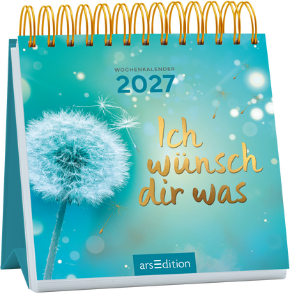 Das Buchcover zeigt einen hellblauen Hintergrund mit sanften Bokeh-Effekten und zarten, goldenen Akzenten. Im Vordergrund befindet sich eine stilisierte Pusteblume in Weiß. Der Titel „Ich wünsch dir was“ ist prominent in verspielter, goldener Schrift platziert, während oben der Jahreszahl 2027 in klaren, weißen Zahlen zu finden ist. Ganz unten mittig steht der Logoschriftzug von arsEdition.