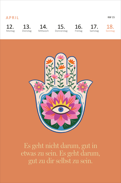 Gezeigt wird eine Innen- oder Zusatzansicht von „Wochenkalender Yogaglück 2027“. Der Kalender präsentiert eine sanfte, orangefarbene Hintergrundfarbe. In der Mitte ist eine stilisierte Hand mit bunten, floral gestalteten Elementen und einer Augenblume abgebildet. Darüber sind die Wochentage in klarer, moderner Typografie angeordnet. Unter der Illustration steht eine inspirierende Botschaft in eleganter Schriftart: „Es geht nicht darum, gut in etwas zu sein. Es geht darum, gut zu dir...