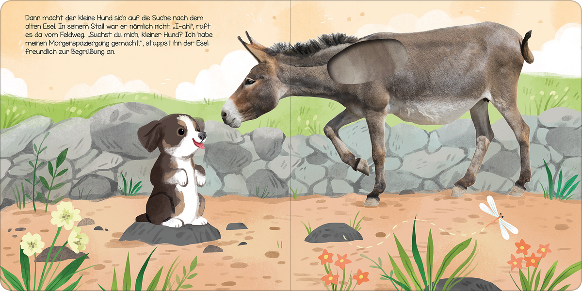 Gezeigt wird eine Innen- oder Zusatzansicht von „Hör mal, kleiner Hund!“. Die Illustration zeigt einen kleinen, braunen Hund, der auf einem Stein sitzt und einem grauen Esel gegenübersteht. Der Hund hat große, leuchtende Augen und wirkt freundlich. Der Hintergrund ist mit sanften, grünen Wiesen und bunten Blumen gestaltet. Die Schrift ist klar und gut lesbar, in einer verspielten, kindgerechten Typografie, die das freundliche und einladende Thema des Buches unterstreicht.