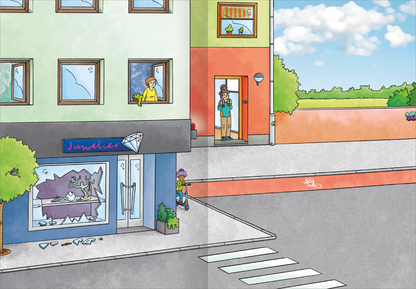 Gezeigt wird eine Innen- oder Zusatzansicht von „Erstes Stickern Metallic – Im Einsatz“. Die Illustration zeigt eine belebte Straßenszene mit zwei mehrstöckigen Gebäuden in sanften Farben, darunter Gelb und Grün. Auf der linken Seite erkennt man einen Juwelierladen mit zerbrochenem Fenster und einem großen, blauen Schaufenster. Auf der Straße stehen eine Person in gelb und eine andere in blau, während im Hintergrund ein klarer Himmel mit wenigen Wolken zu sehen ist.