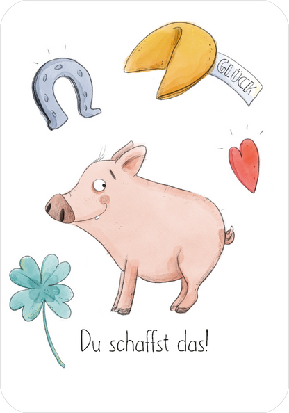 Gezeigt wird eine Innen- oder Zusatzansicht von „Mutmachkarten“. Die Karte zeigt ein fröhliches, rosa Schweinchen von der Seite, das optimistisch lächelt. Umgeben wird es von einem vierblättrigen Kleeblatt, einem Hufeisen, einem Glückskeks und einem roten Herz. Die zentrale Botschaft „Du schaffst das!“ ist in einer handschriftlichen, gut lesbaren Typografie gestaltet.