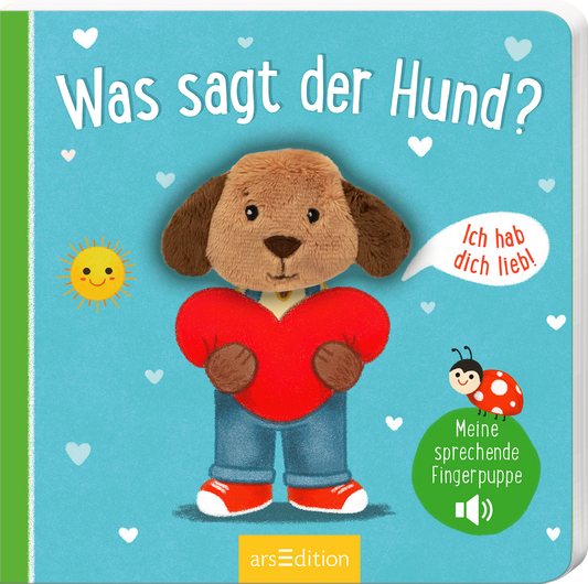 Das Cover zeigt einen niedlichen, plüschigen Hund mit einem herzförmigen roten Kissen. Der Hund trägt ein blaues Shirt und eine blaue Jeans. Der Hintergrund ist in einem sanften Himmelblau gehalten, dekoriert mit kleinen weißen Herzen und einer gelben Sonne. Die Titelzeile „Was sagt der Hund?“ ist in verspielter Schrift in Weiß gestaltet. Im oberen Bereich spricht eine Sprechblase mit dem Text „Ich hab dich lieb!“. Rechts ist ein grüner Button mit der Aufschrift „Meine...