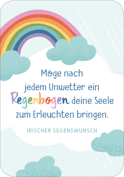 Gezeigt wird eine Innen- oder Zusatzansicht von „Segenswünsche für dich“. Die Darstellung umfasst einen bunten Regenbogen in sanften Farben über hellblauen Wolken. Der Text in verspielter Schriftart lautet: „Möge nach jedem Unwetter ein Regenbogen deine Seele zum Erleuchten bringen.“ Am unteren Rand befindet sich der Hinweis „IRISCHER SEGENSWUNSCH“ in einer klaren, gut lesbaren Schrift. Die Gesamtkomposition vermittelt eine positive und liebevolle Botschaft.