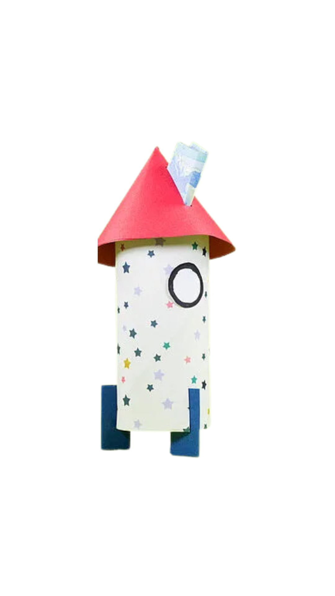 Selbstgebastelte Rakete aus einer weißen Papprolle, dekoriert mit bunten Sternen, einem schwarzen Kreis als Fenster, blauen Papierbeinen und einer roten Papierkegelkappe als Spitze. Oben ragt ein kleiner Geldschein heraus.