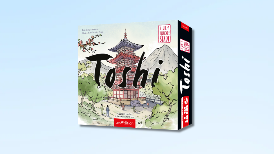 Vor hellblauem Hintergrund steht schräg eine Spielanleitung mit dem Titel „Toshi“. Das Cover zeigt eine japanische Pagode vor einem Berg, umgeben von Bäumen und blühenden Zweigen. Mehrere Personen stehen davor. Auf dem Einband sind außerdem rote und schwarze Schriftflächen sowie das Logo von arsEdition zu sehen.