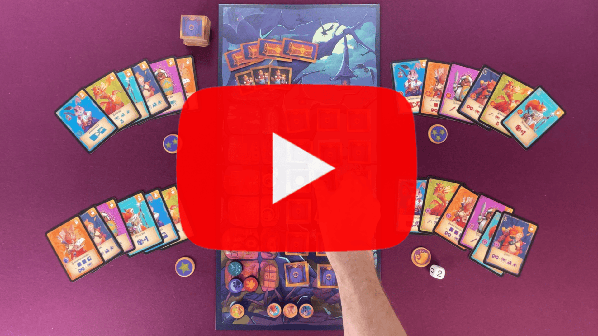 Video laden: Im Video wird das Spiel Dämmerwache erklärt, dabei sind Hände von oben zu sehen, die das Spielfeld und die Karten zeigen.